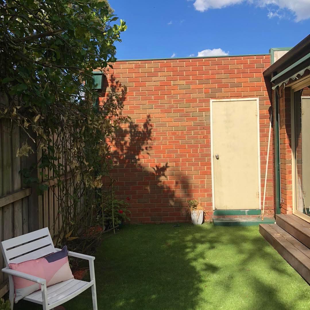 After: courtyard cleared and turfed